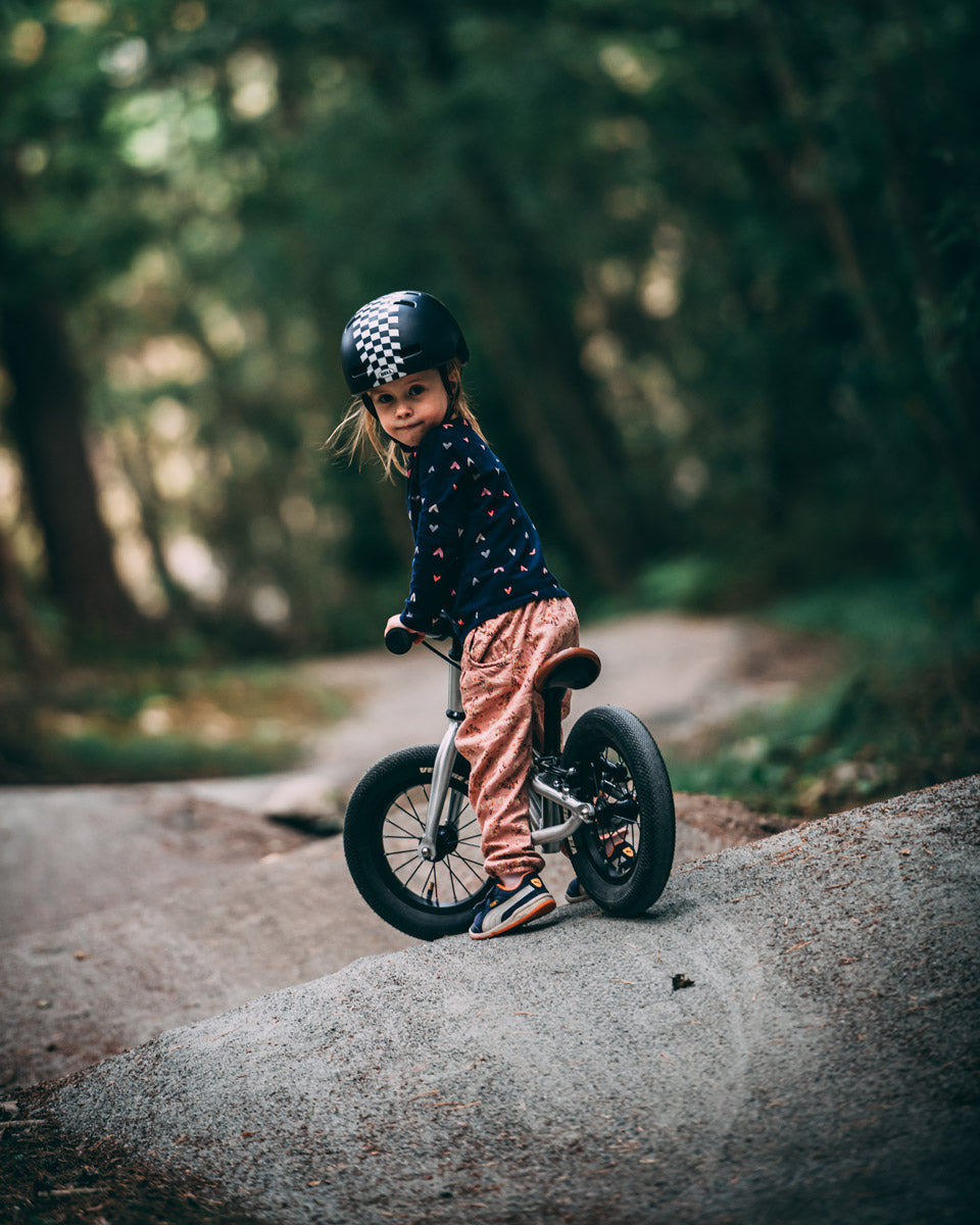 Young girl sat on the Early rider charger balance bike