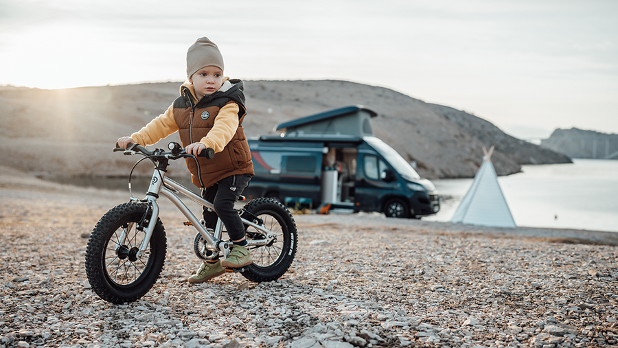 Small child riding an Early Rider bike