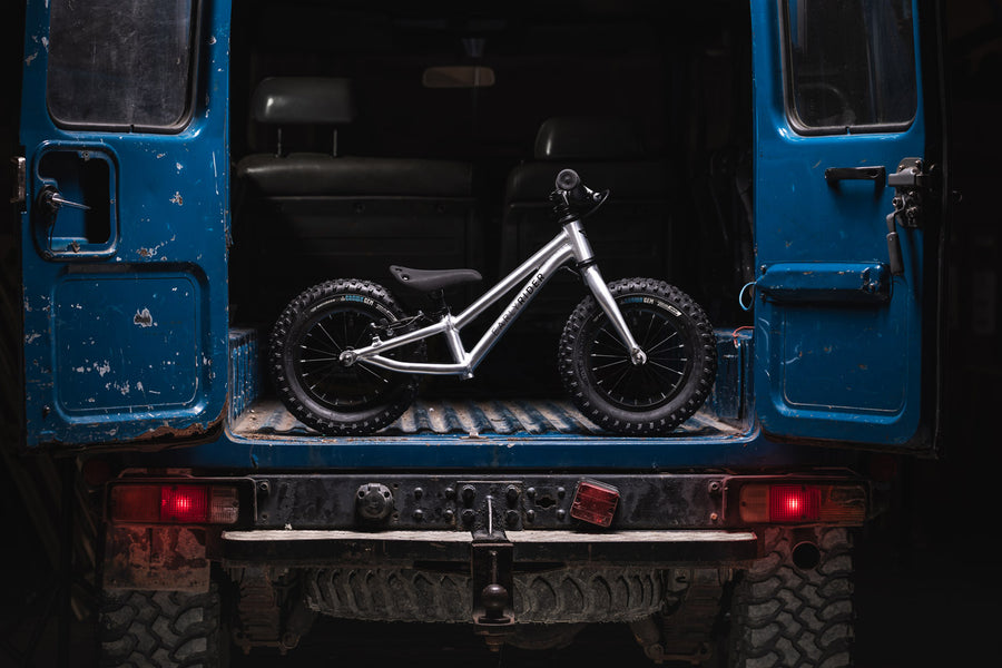 Early rider childrens 12 inch balance bike in the back of a blue 4x4 truck