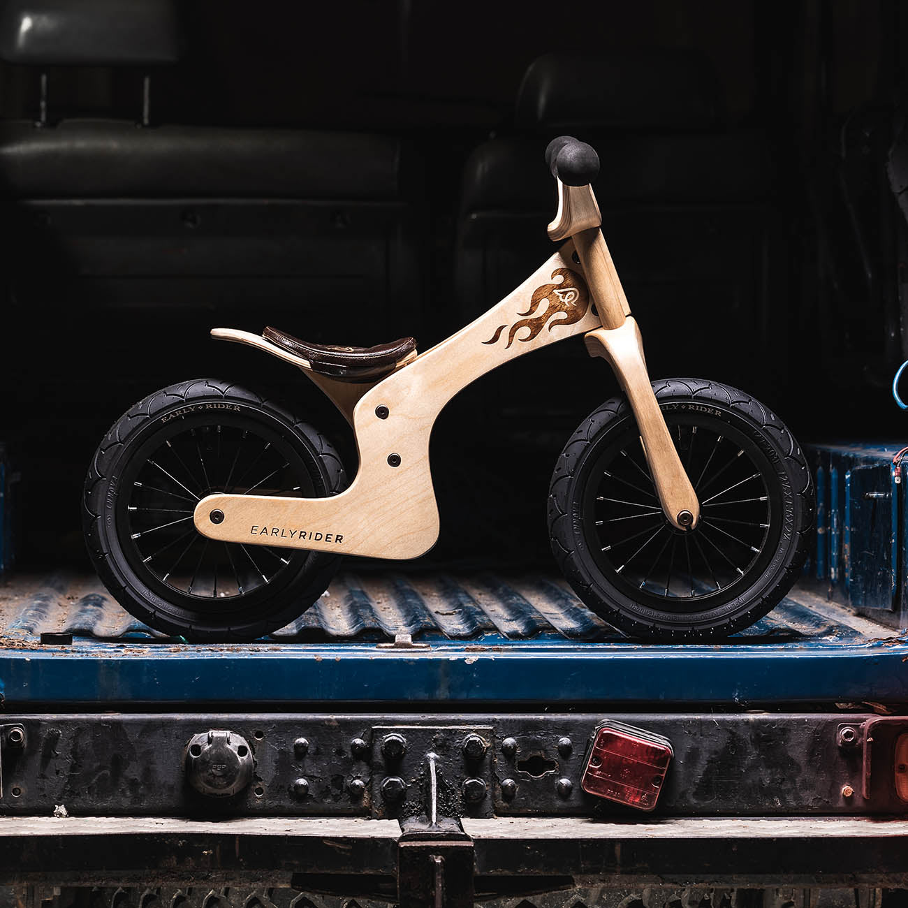 early rider wooden balance bike on the back of a truck