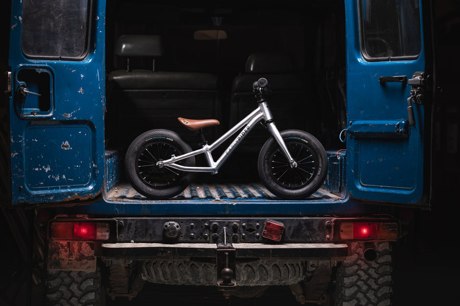 Early rider 12 inch charger balance bike in the back of a blue 4x4 truck