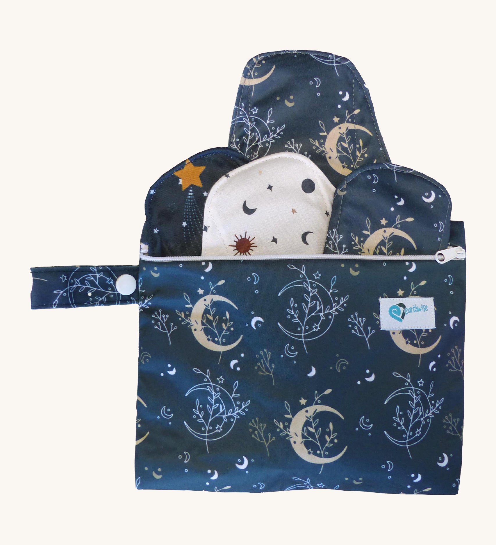 Earthwise starter kit includes 4 reusable period pads and a coordinating mini wet bag purse in Celestial print.