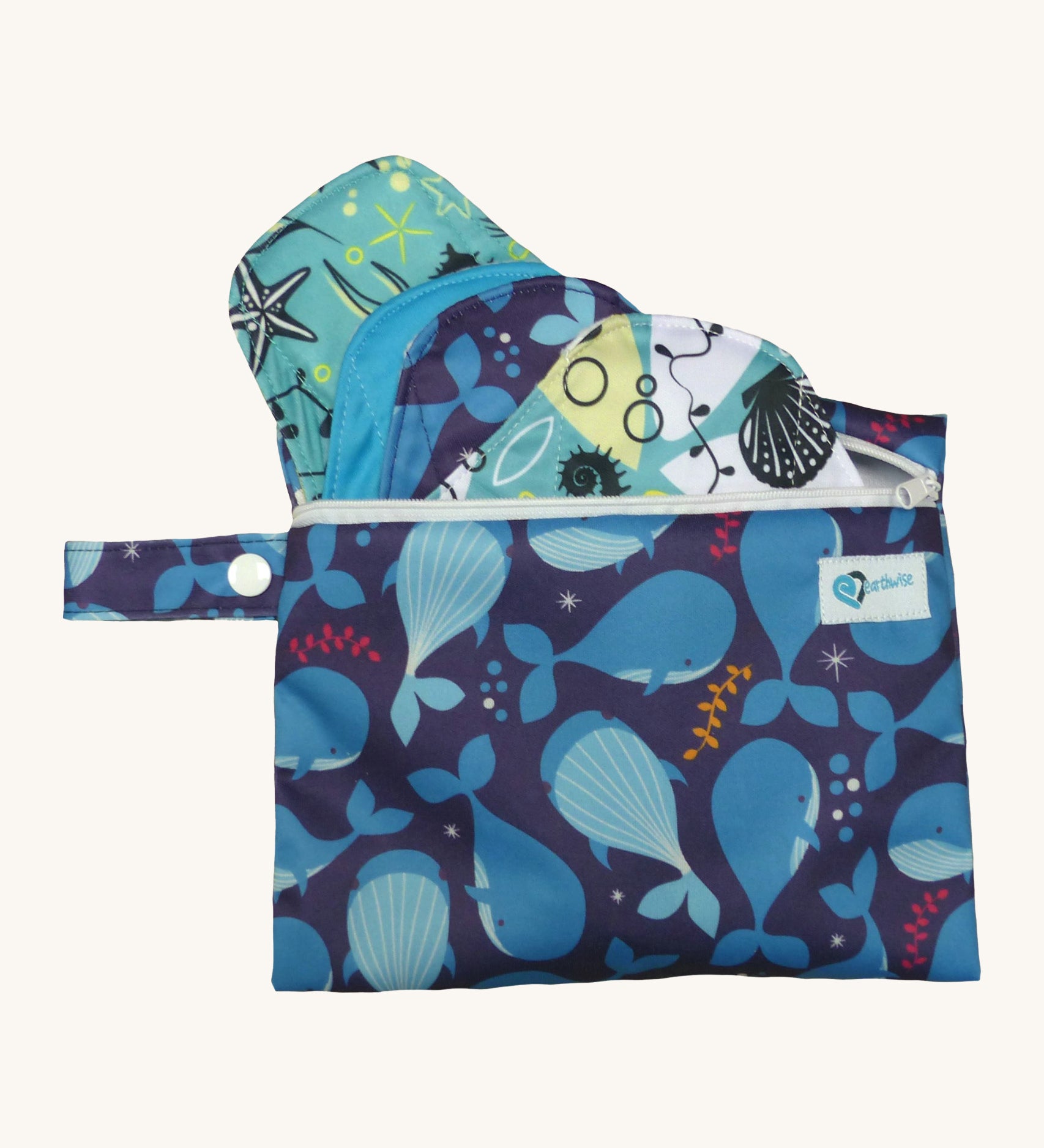 Earthwise starter kit includes 4 reusable period pads and a coordinating mini wet bag purse in Under the sea print.