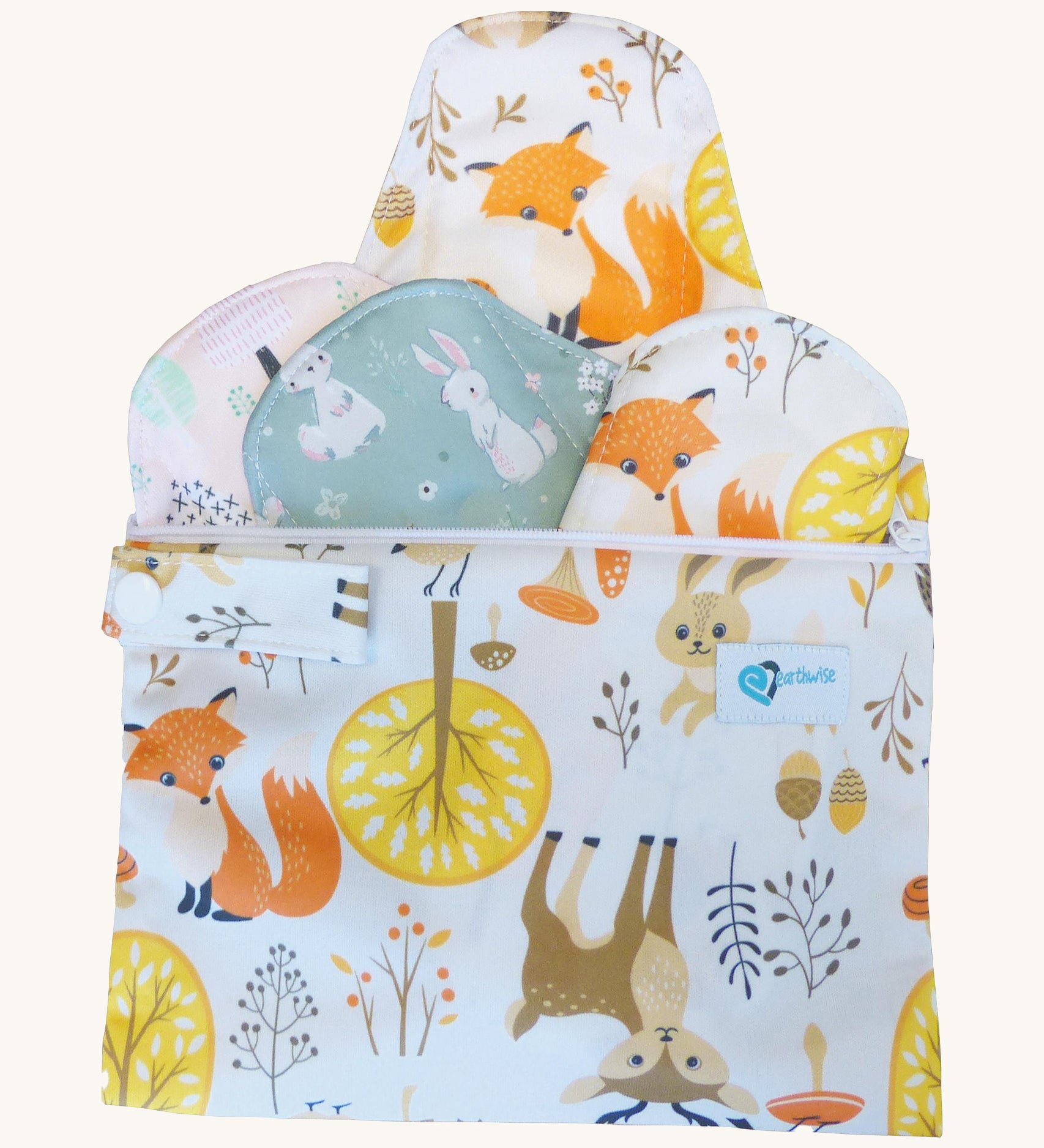 Earthwise starter kit includes 4 reusable period pads and a coordinating mini wet bag purse in Woodland print.