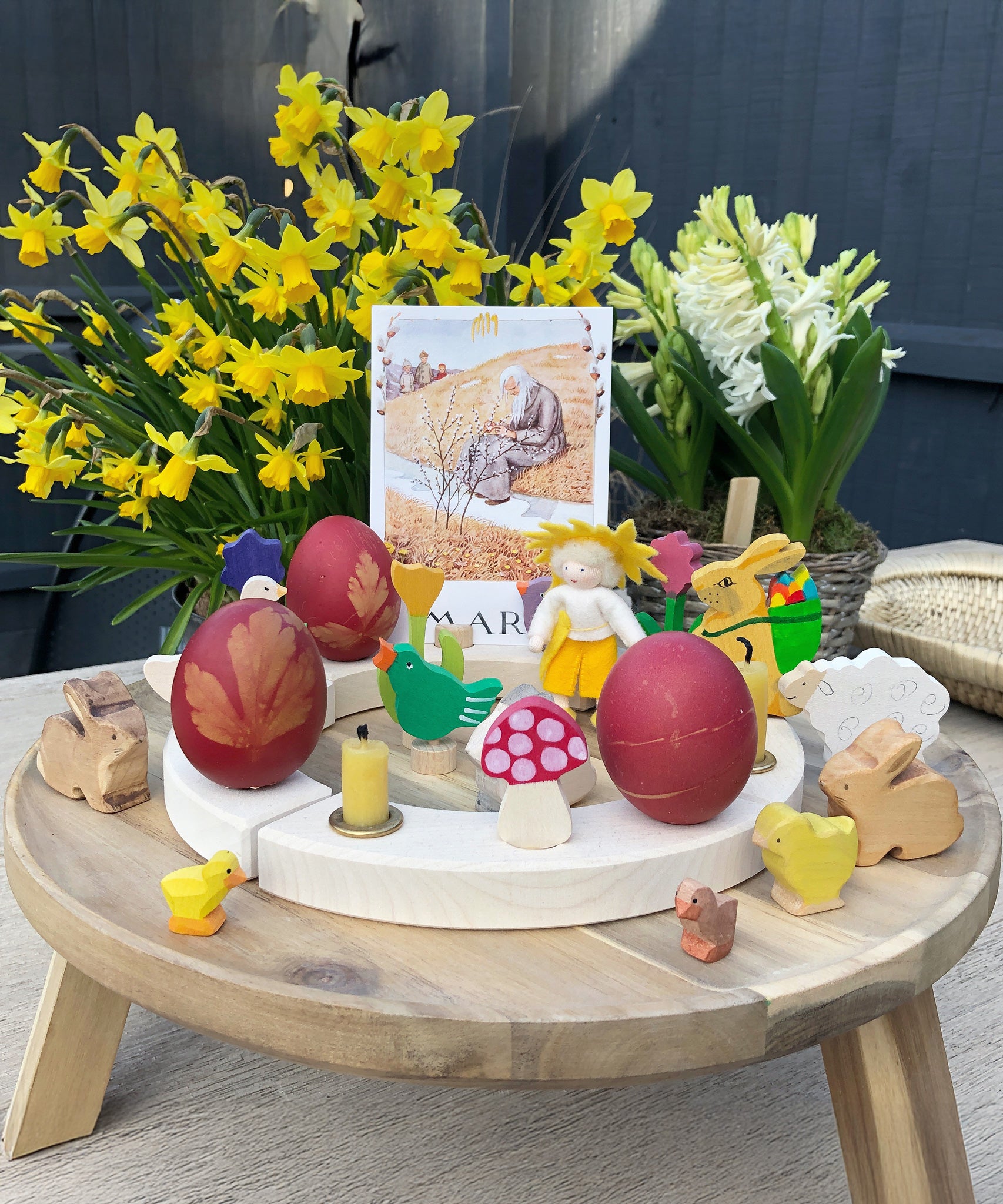 Eggs dyed using teh Okonorm egg dye kit shown on a celebration ring display with Easter and Spring themed toys and decorations. 