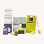 Eco Living cleaning starter set including a Eco Living dish brush, lavender soap, compostable sponge cloths, natural latex rubber gloves, dish brush, loofah sponge and pot brush