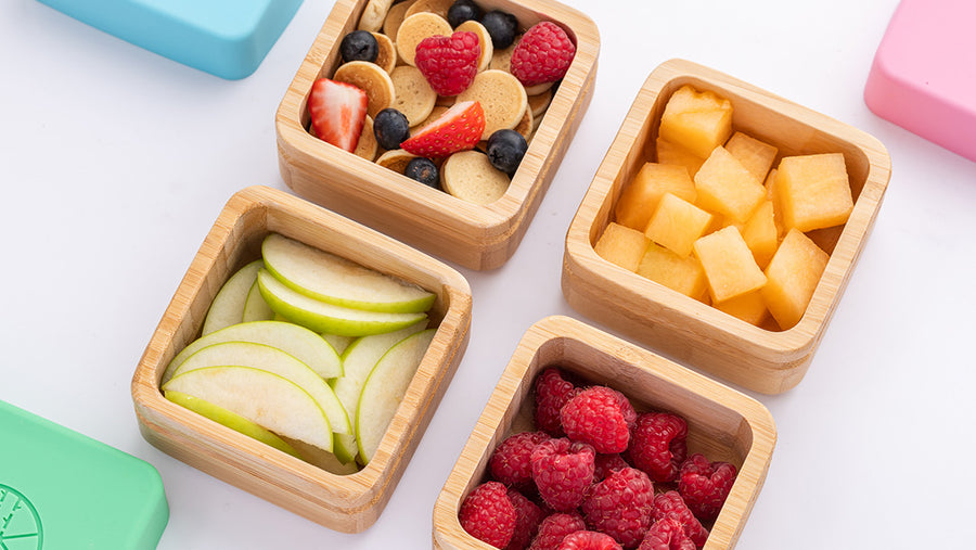 The Eco Rascals snack pots filled with fruits.