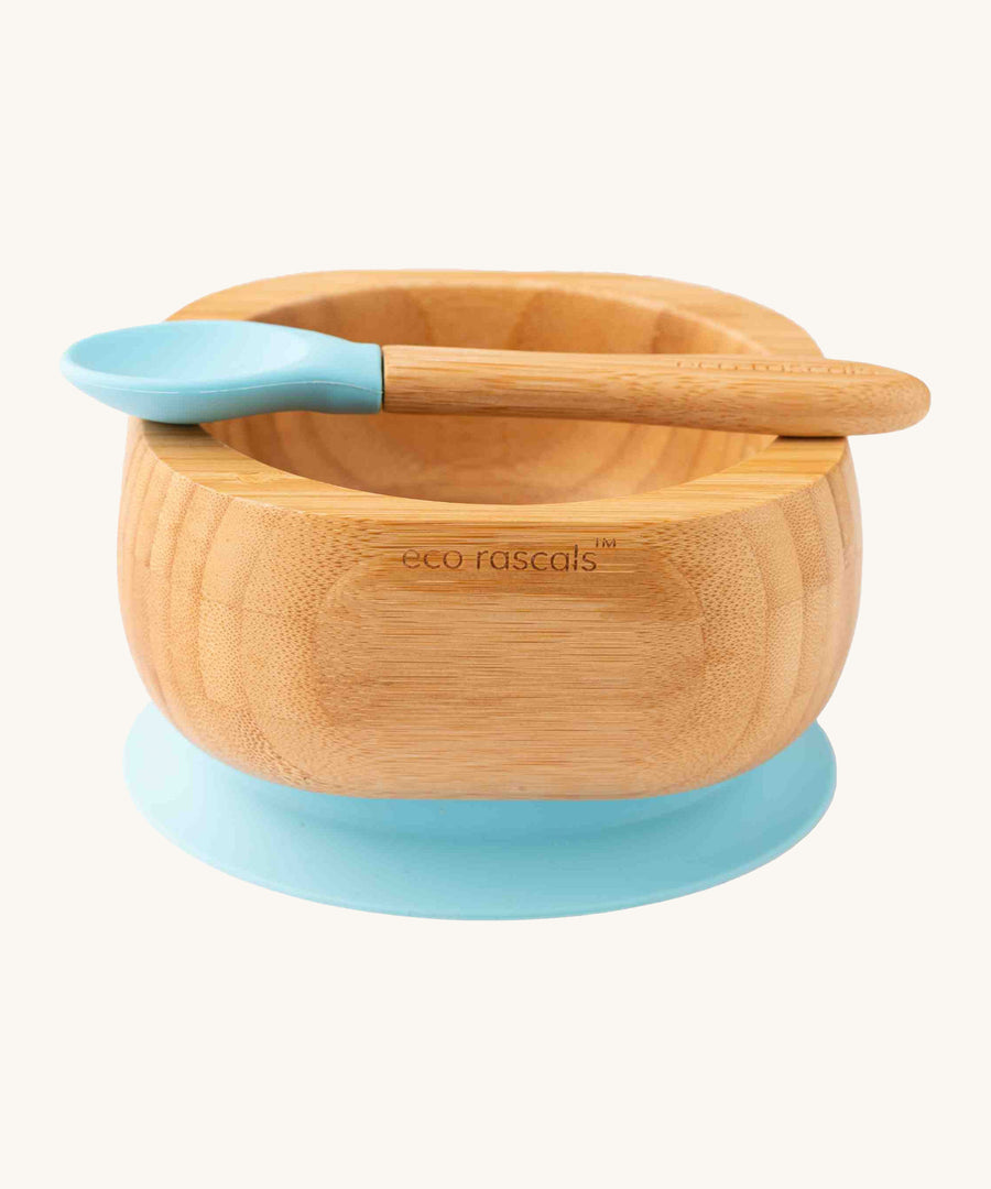 Bamboo baby weaning bowl and spoon with blue silicone tip and suction pad.