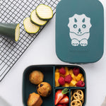 An overhead view of the teal dinosaur design Eco Rascals Stainless Steel Character Lunch Box. Hidden veg muffins are placed in the largest silicone segment, with fruit and pretzels in the other 3 smaller sections. 