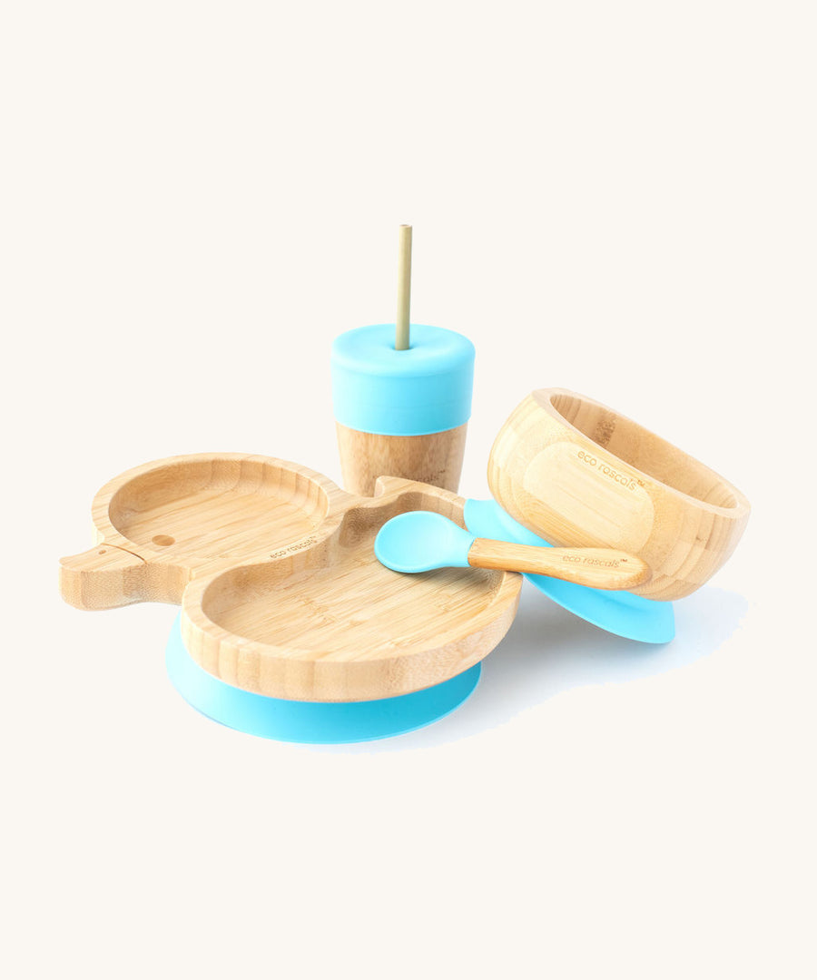 A bamboo baby weaning set by Eco Rascals including a duck-shaped bamboo weaning suction plate, a sippy cup, and a suction bamboo bowl with blue silicone details.