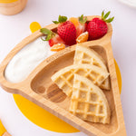 The Eco Rascals Pizza Bamboo Suction Plate with food inside, waffles are placed in the large triangle section and fruit and yoghurt are in the smaller curved section above. 