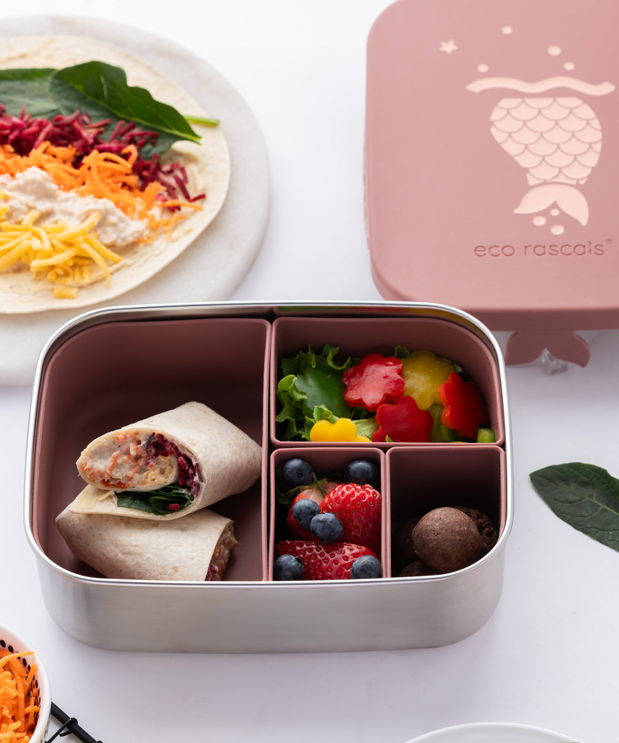 Eco Rascals Stainless Steel rose mermaid Character Lunch Box with food inside. Rainbow wraps in the largest section and fruit and vegetables in the other three smaller sections. 