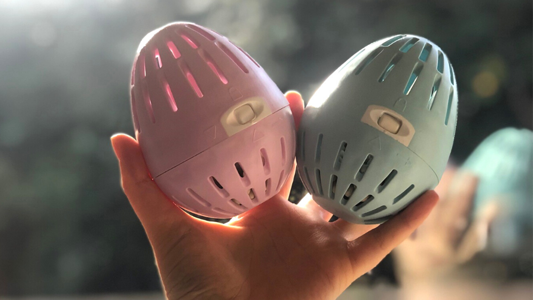 Person holding up two Ecoegg laundry eggs