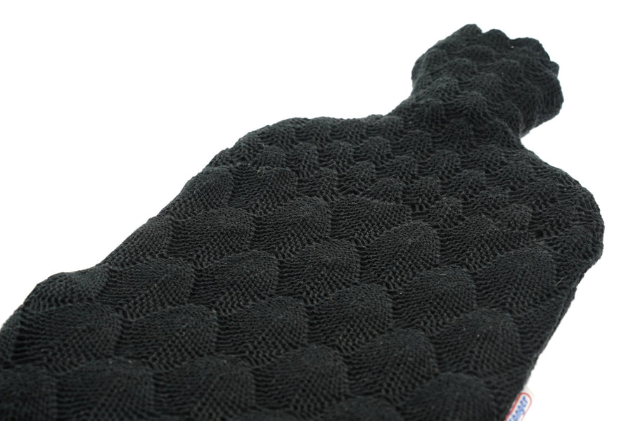 Close up of the black textured knit on the Ecoliving natural rubber hot water bottle