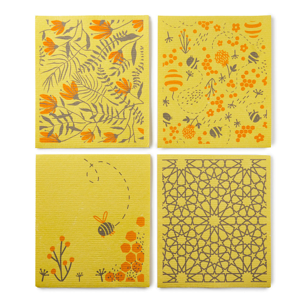 4 yellow Ecoliving compostable sponge cleaning cloths laid out in a square showing the different patterns