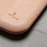 Close up of Ecoliving logo carved into the corner of sustainable Beech wood chopping board