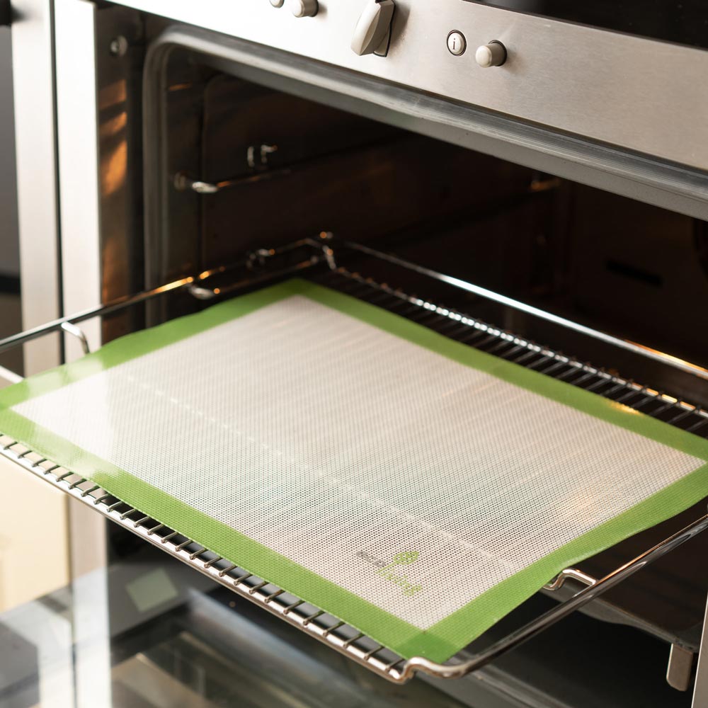 Ecoliving Reusable Silicone Baking Liner on a oven rack in an oven