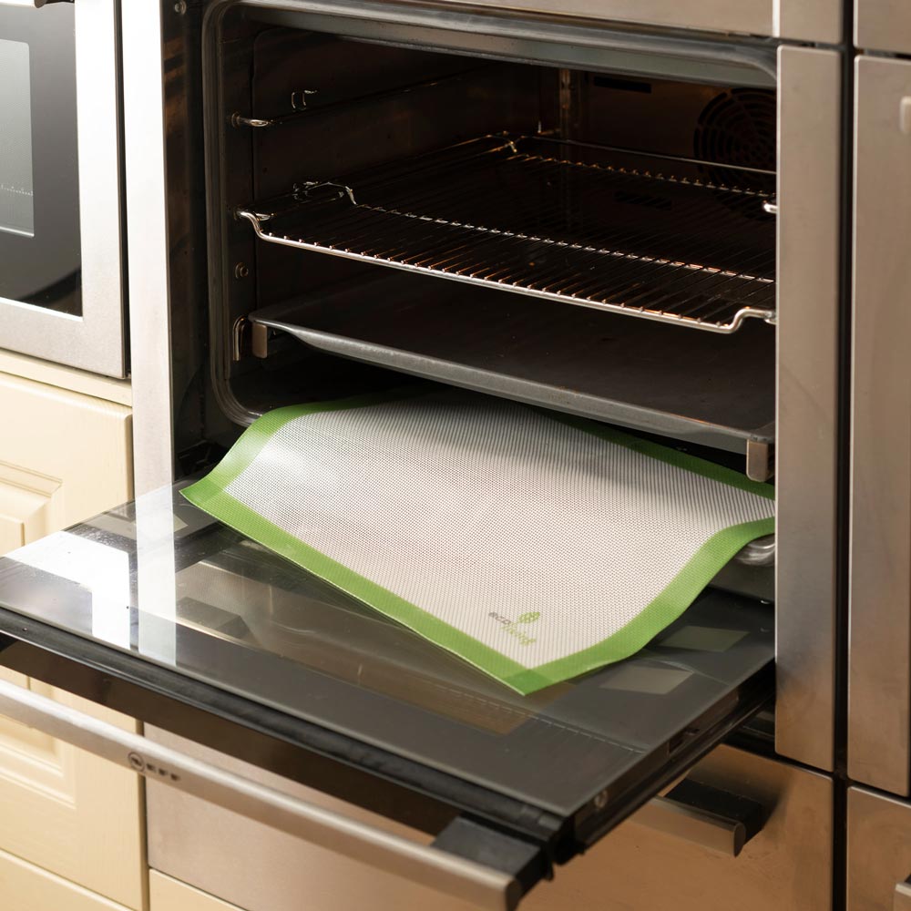 Ecoliving Reusable Silicone Baking Liner on the bottom shelf of an oven