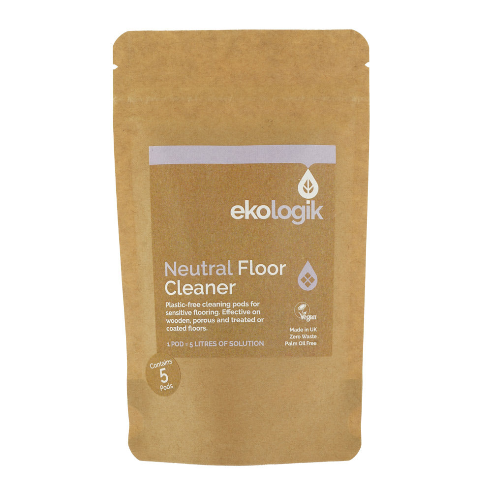 Ekologik Neutral floor cleaner packet stood in front of mop and bucket (out of focus) on wooden floor.