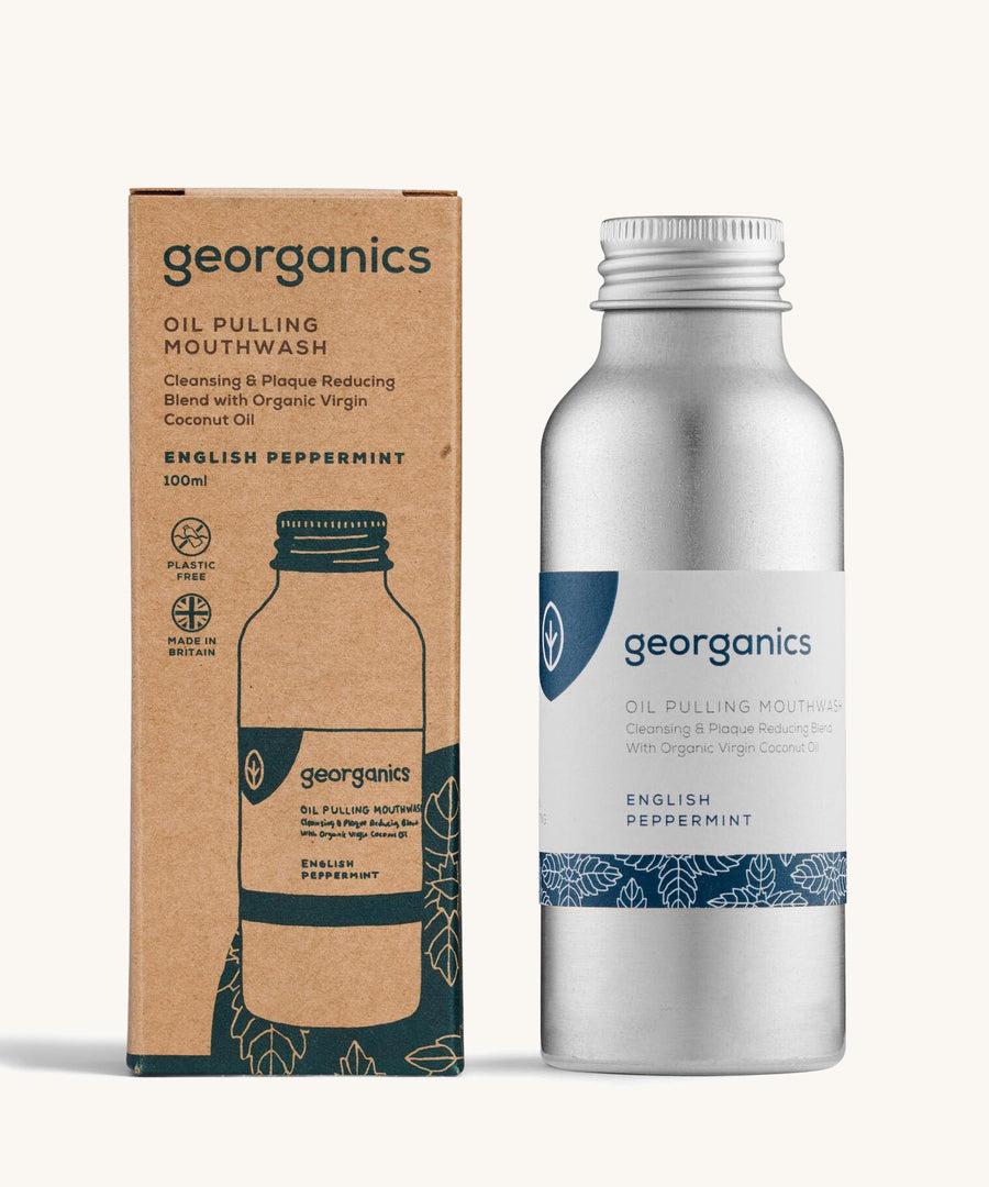 A bottle of the Georganics english peppermint oil pulling mouthwash with the box