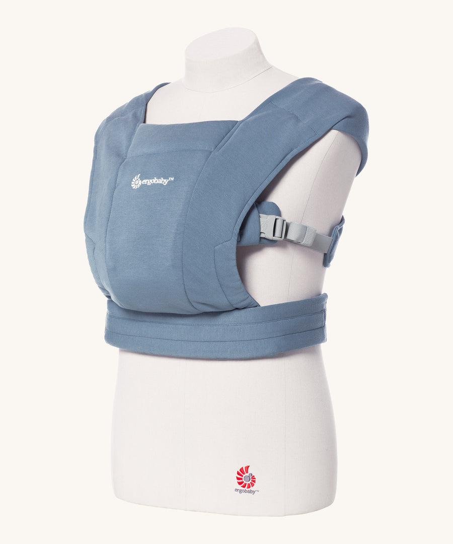 Ergobaby Embrace Soft Knit Newborn Baby Carrier in Oxford Blue. Side view on a mannequin.