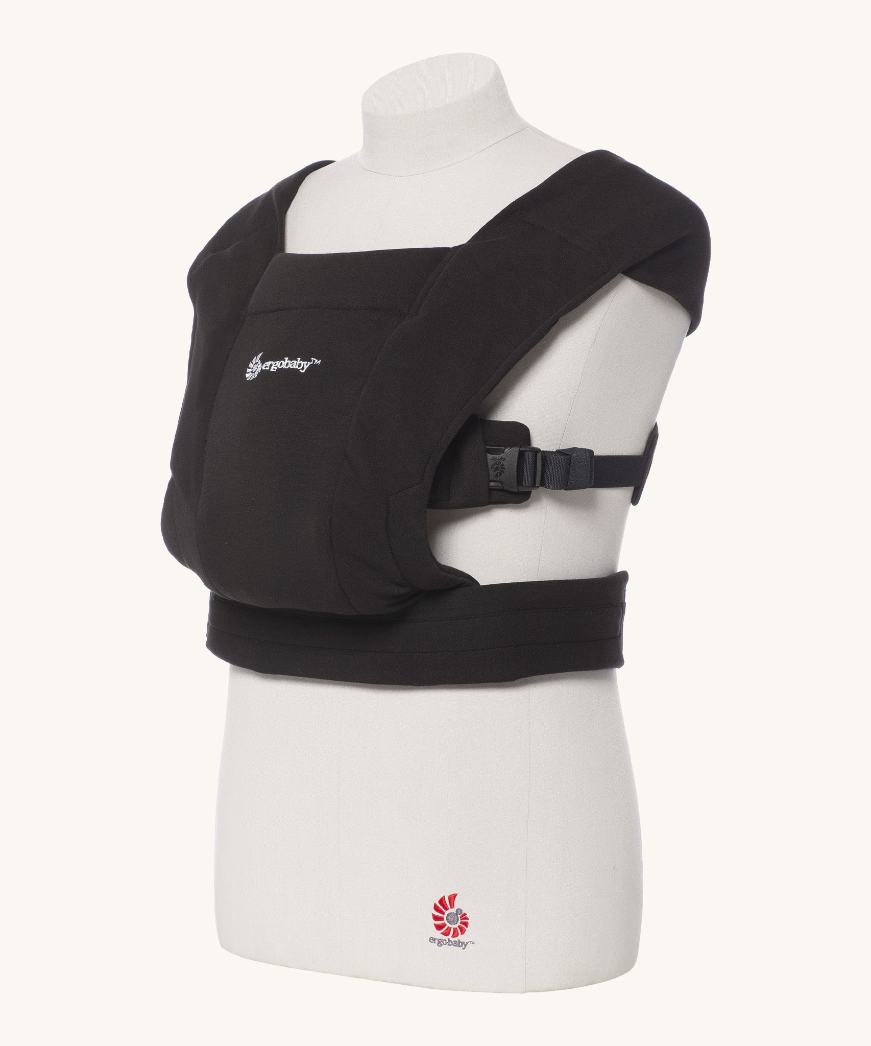 Ergobaby Embrace Soft Knit Newborn Baby Carrier in Pure Black. Side view on a mannequin.