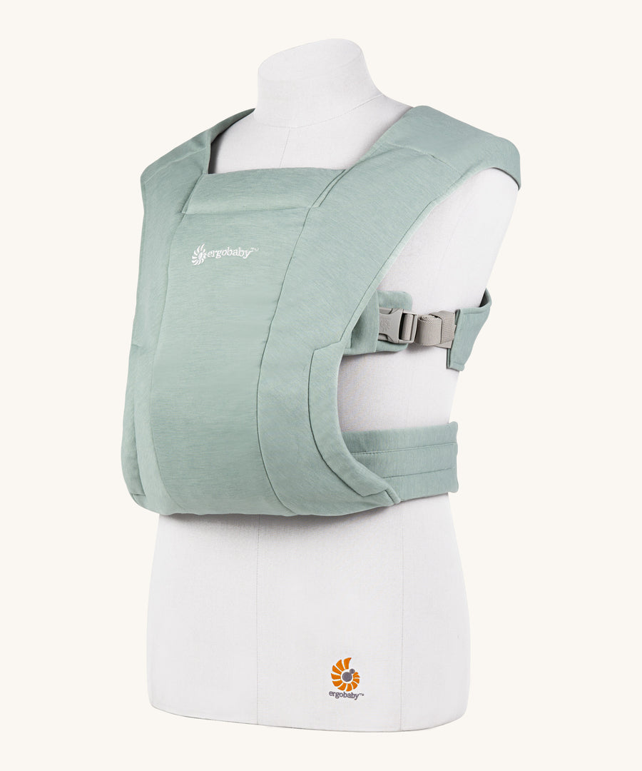 Ergobaby Embrace Soft Knit Newborn Baby Carrier in Jade. Side view on a mannequin.