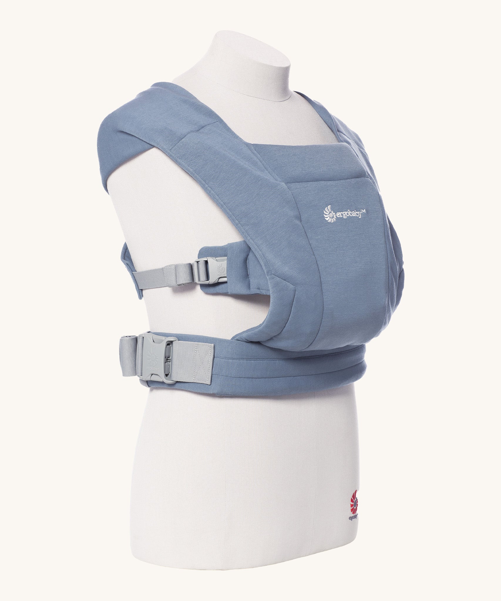 Ergobaby Embrace Soft Knit Newborn Baby Carrier in Oxford Blue. Side view on a mannequin.