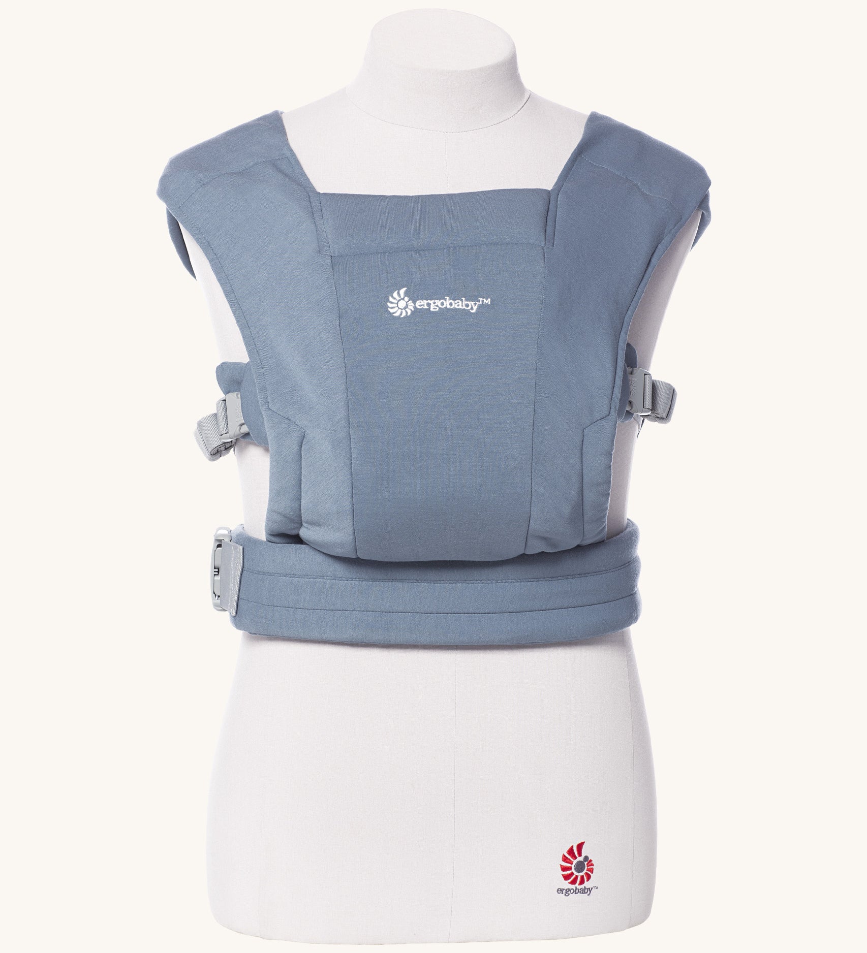 Ergobaby Embrace Soft Knit Newborn Baby Carrier in Oxford Blue. Front view on a mannequin.