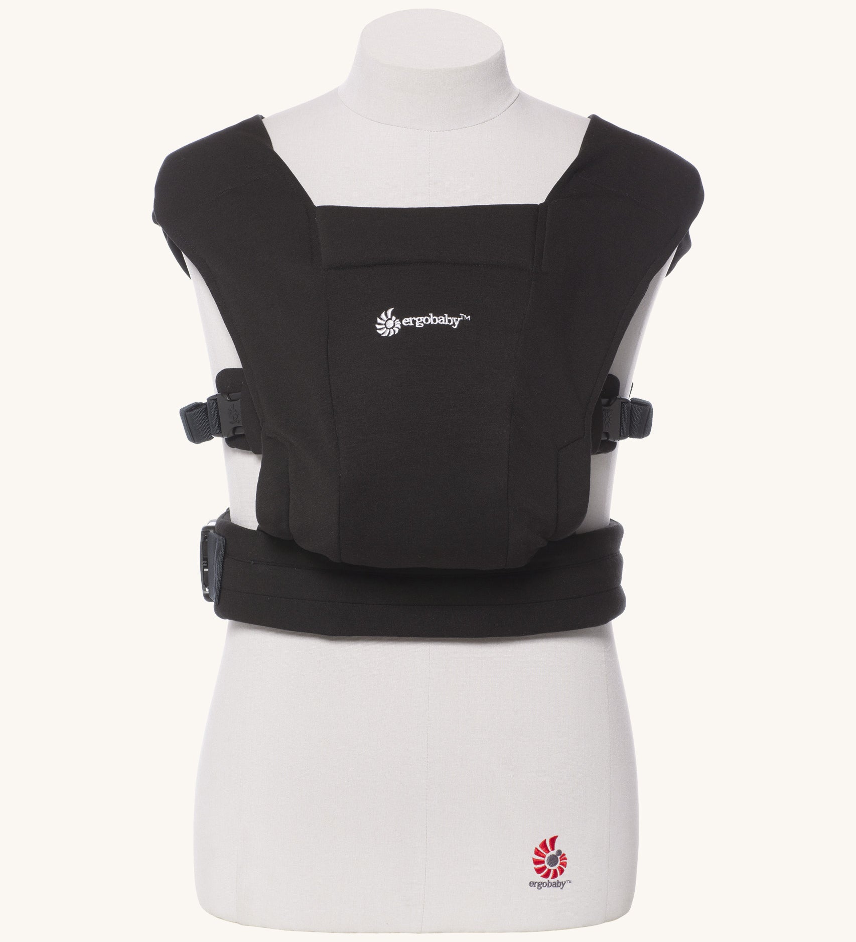 Ergobaby Embrace Soft Knit Newborn Baby Carrier in Pure Black. Front view on a mannequin.