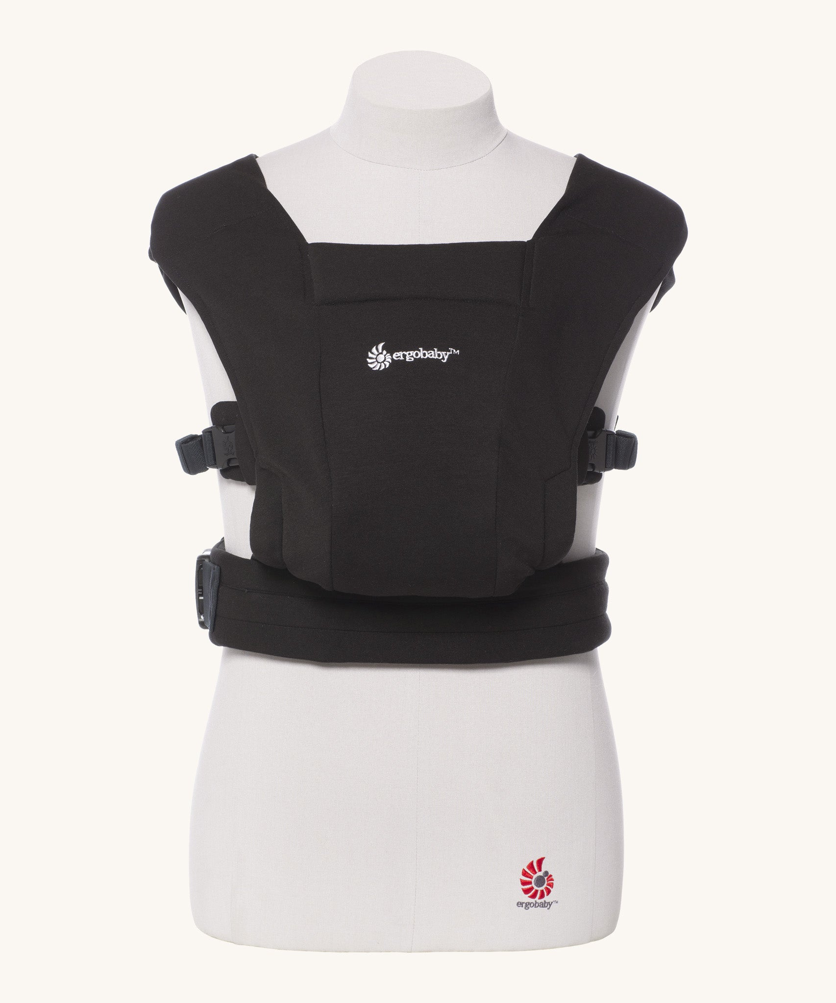 Ergobaby Embrace Soft Knit Newborn Baby Carrier in Pure Black. Front view on a mannequin.