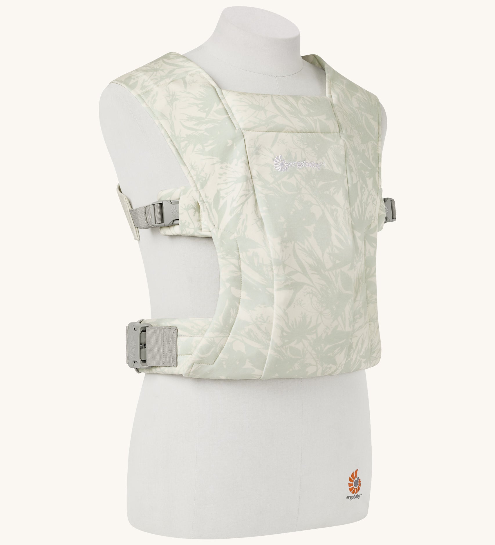 The Ergobaby Soft & Snug knit baby carrier in a sage meadows pattern.