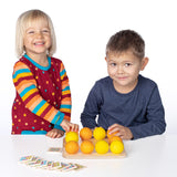 Erzi wooden multicoloured balls stacking game on a wooden base played with