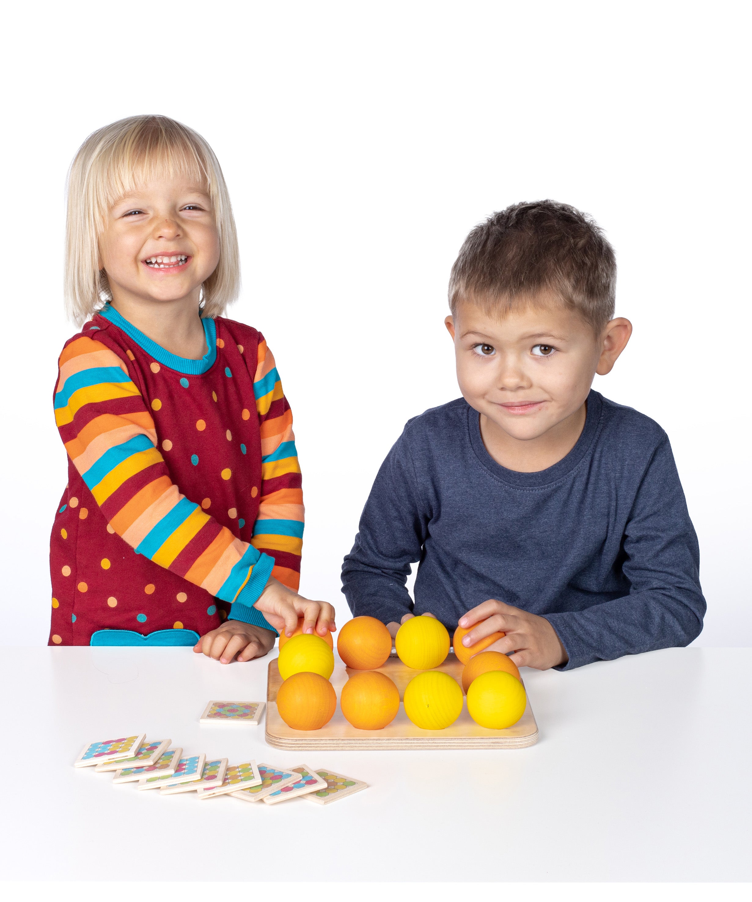 Erzi wooden multicoloured balls stacking game on a wooden base played with