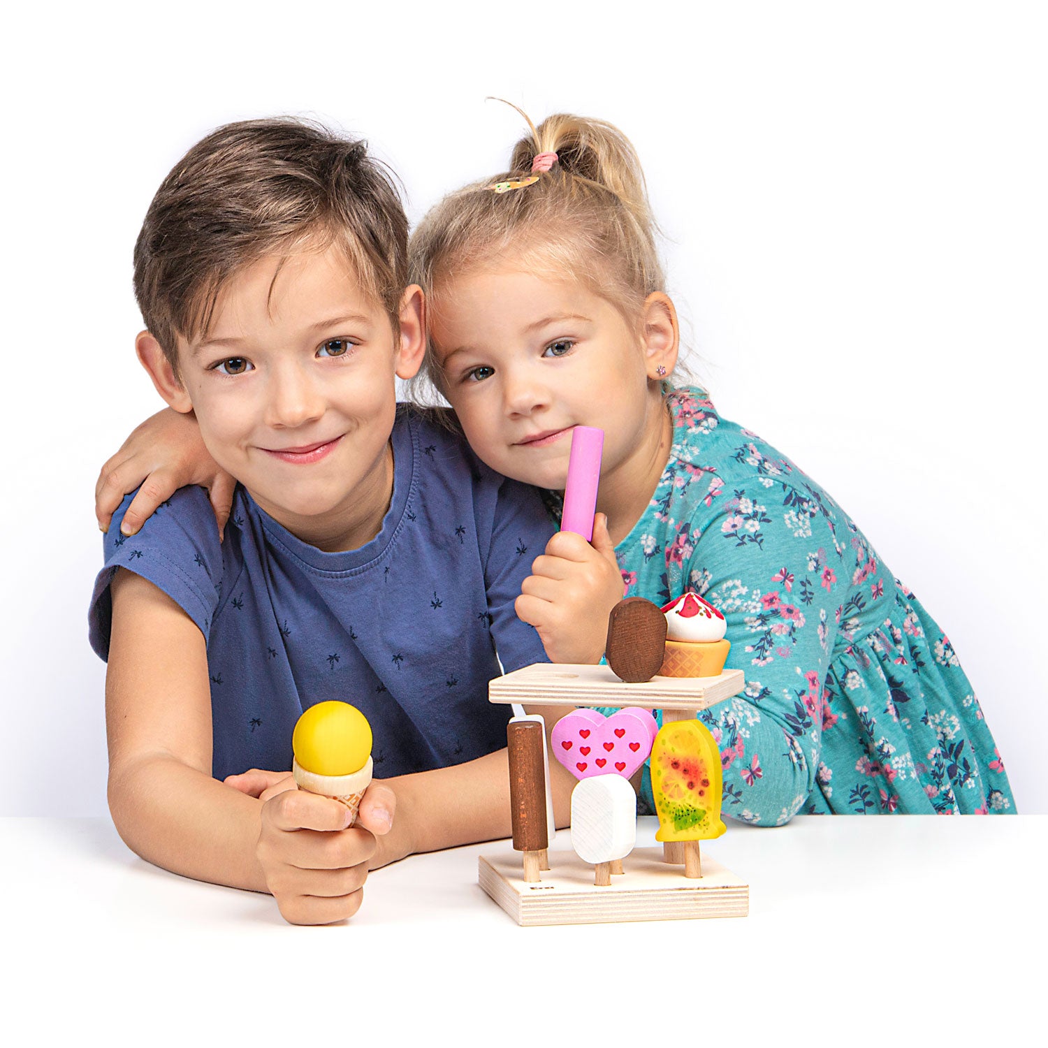 Two children playing with ice creams from the Erzi wooden Summerfresh play food Ice Cream Stand