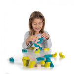 Girl playing with the Erzi eco-friendly stacking wooden geoblocks on a white background