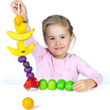 Erzi wooden threading fruits educational game played with a child