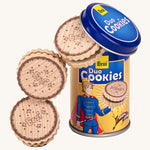 Erzi wooden duo cookies next to tin packaging on a cream background.