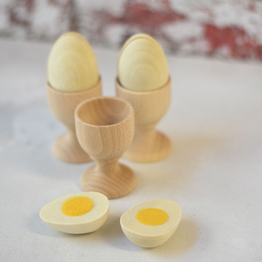 Three Erzi Egg To Cut Wooden Play Food eggs in wooden egg cups