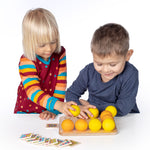 Erzi wooden multicoloured balls stacking game on a wooden base played with by 2 children