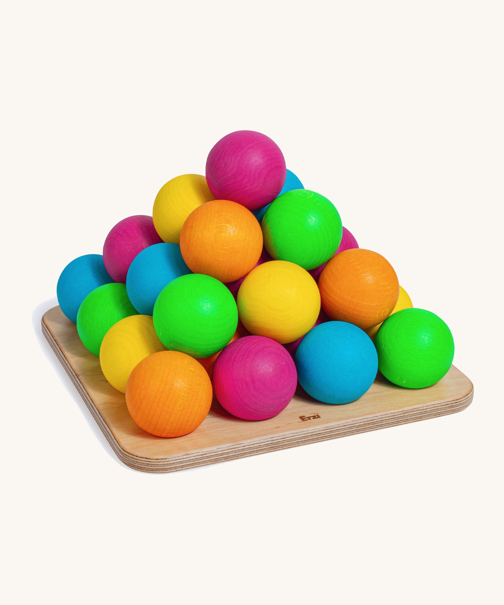 Erzi wooden multicoloured balls stacking game on a wooden base on a cream background.