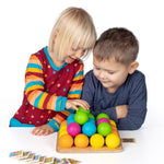 Erzi wooden multicoloured balls stacking game on a wooden base played with by 2 children