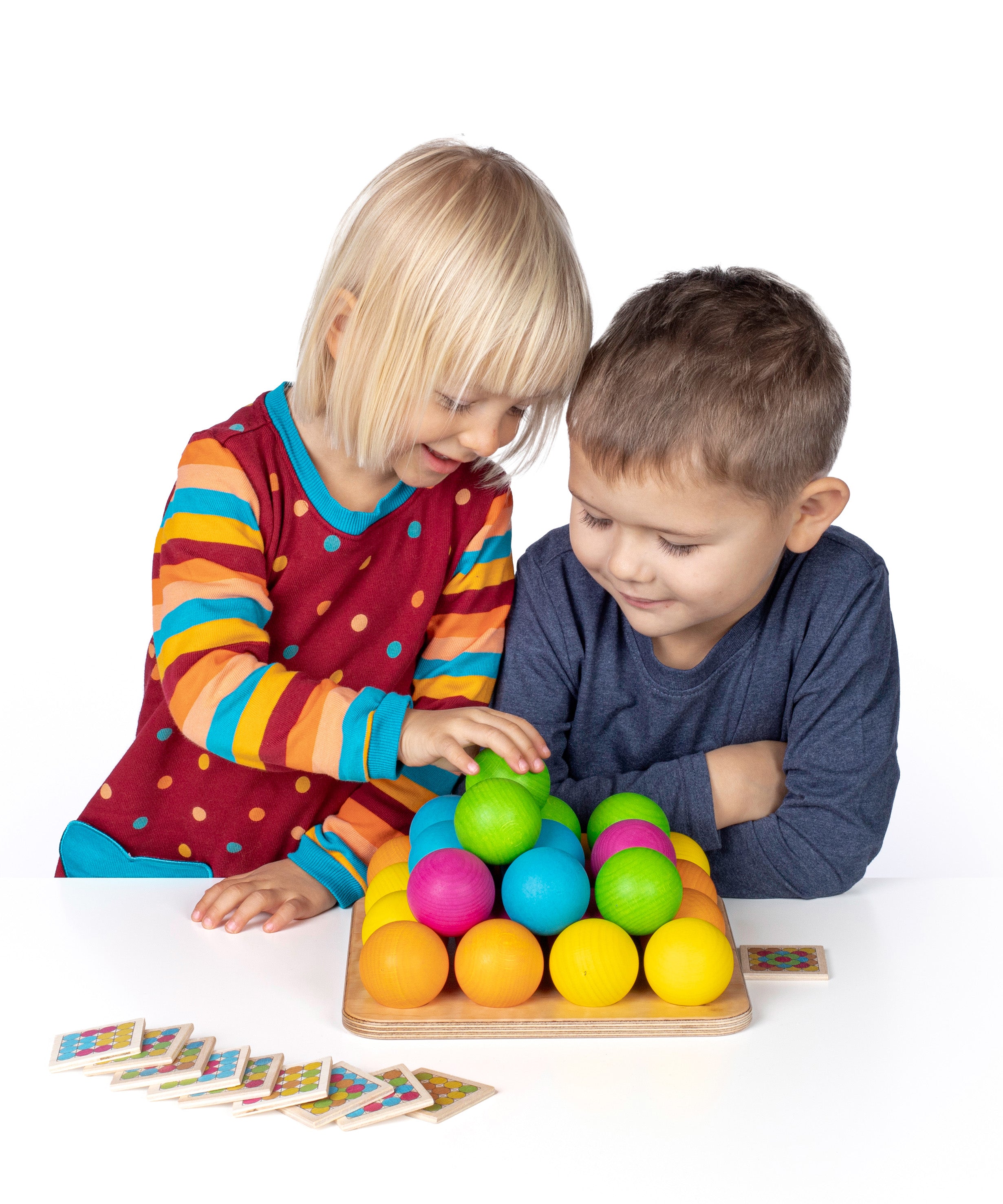 Erzi wooden multicoloured balls stacking game on a wooden base played with by 2 children