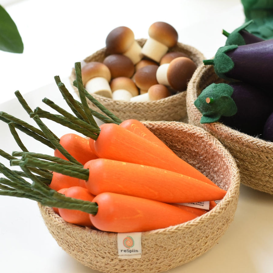 A woven bowl of Erzi wooden toy chestnut mushrooms