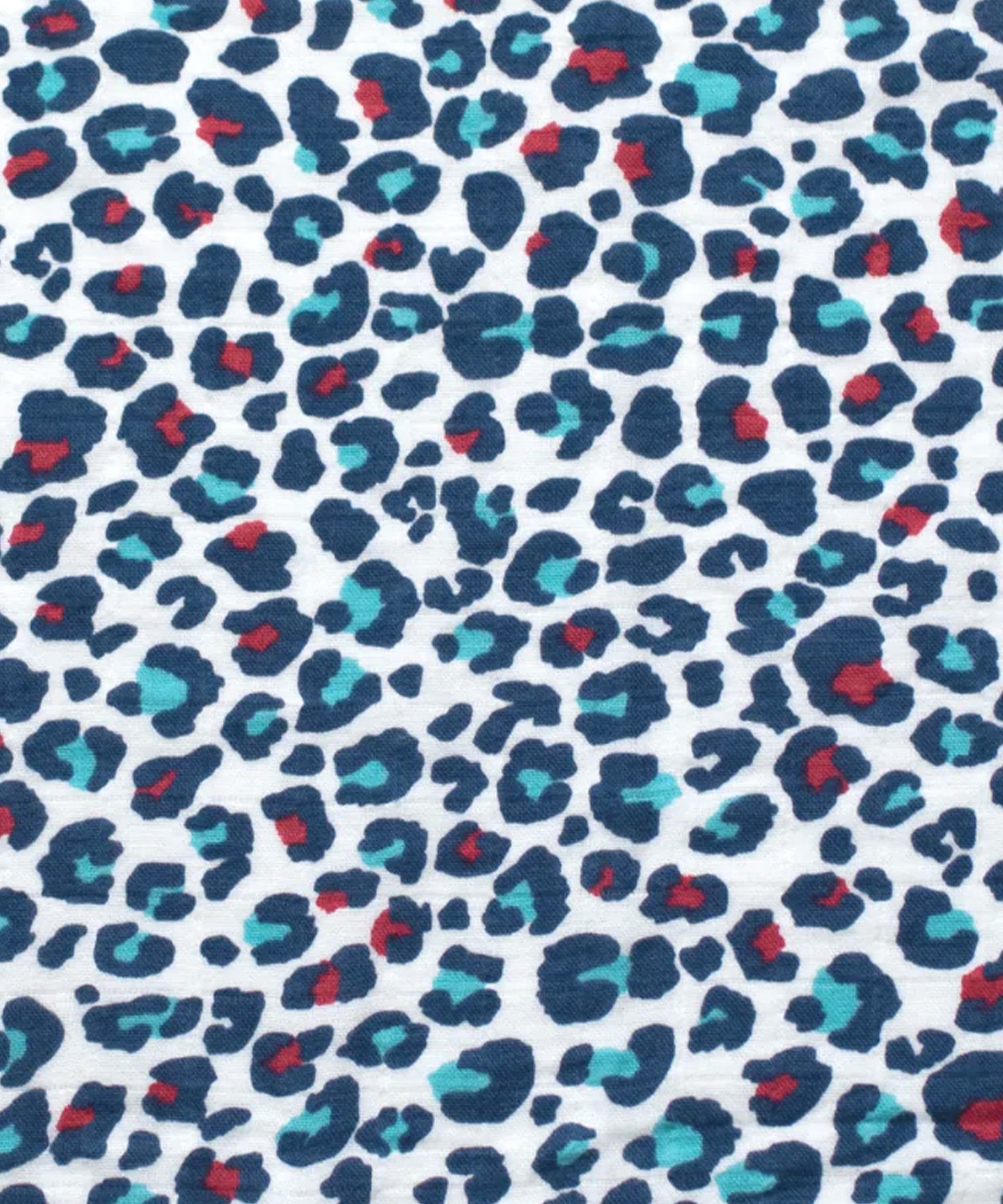 A closer look at the colourful red and light blue spotted print on the Etta Loves Extra Large Organic Cotton Baby Muslin Square - Blue Leopard