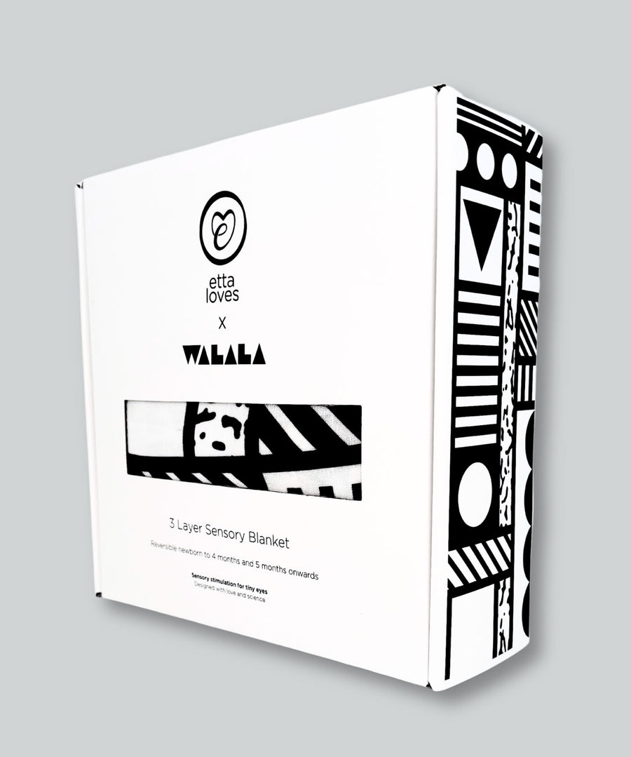 The Etta Loves x Camille Walala Muslin Blanket shown in it's box. 