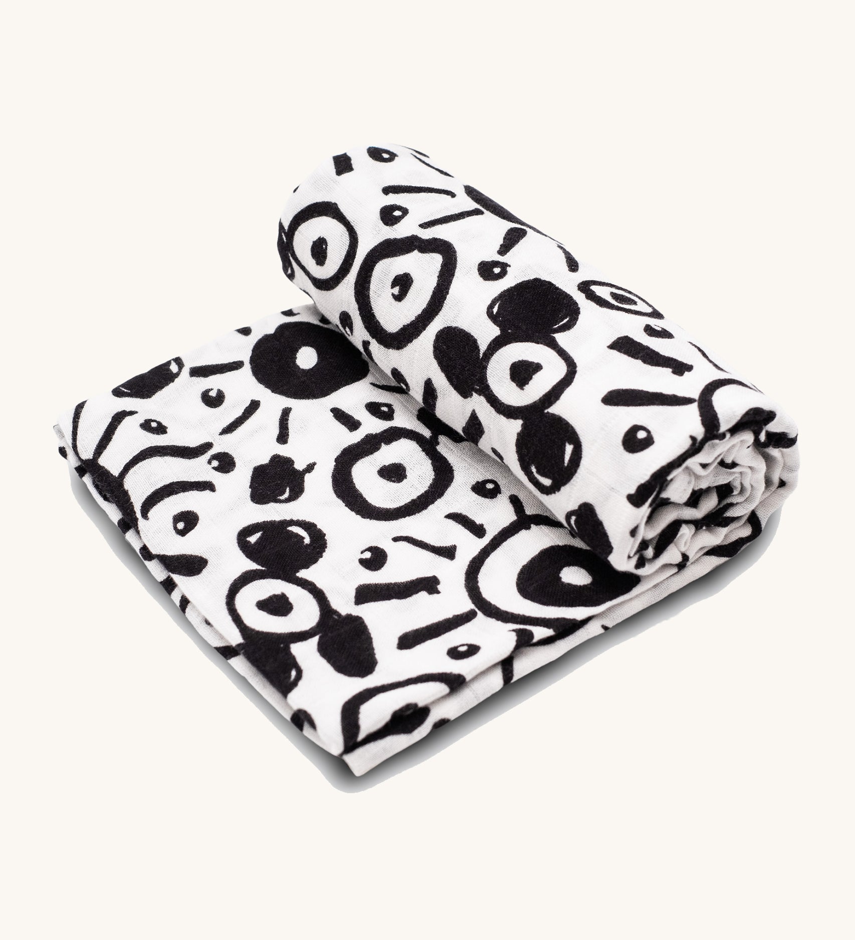 Etta Loves Extra Large Organic Cotton Baby Muslin Square - Eyes. Made from GOTS Organic Cotton, with large black circle patterns on a cream background