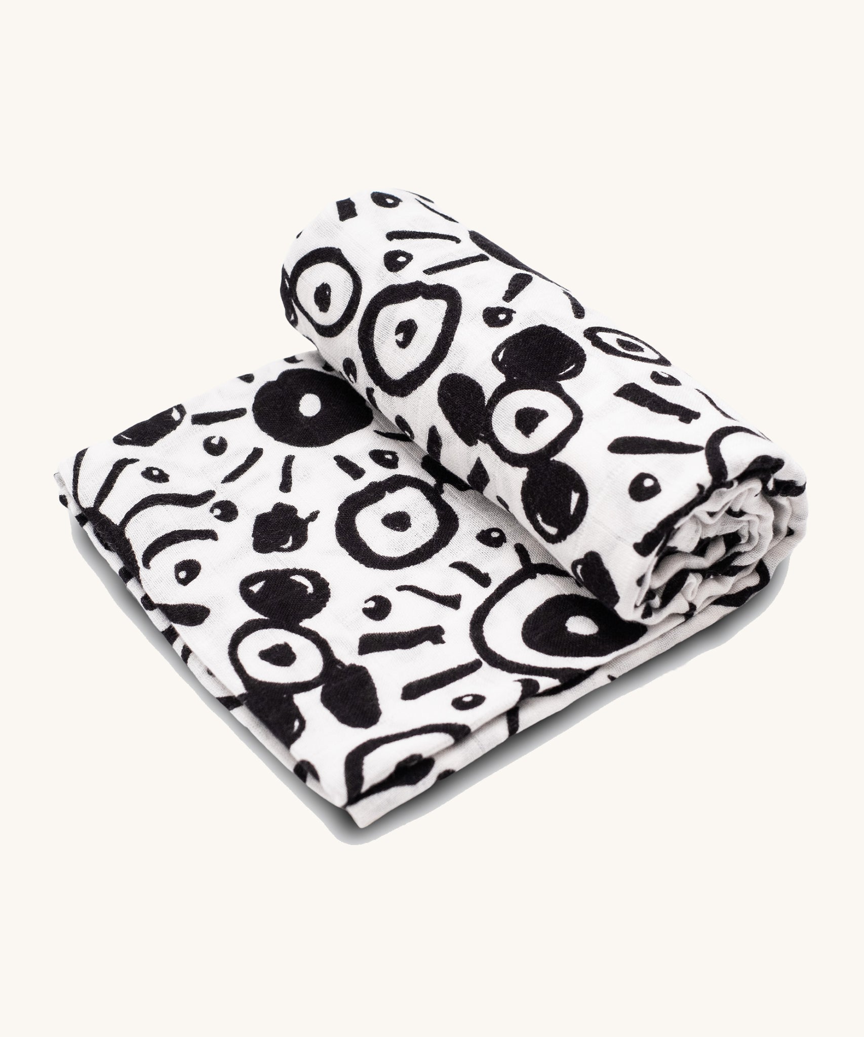 Etta Loves Extra Large Organic Cotton Baby Muslin Square - Eyes. Made from GOTS Organic Cotton, with large black circle patterns on a cream background