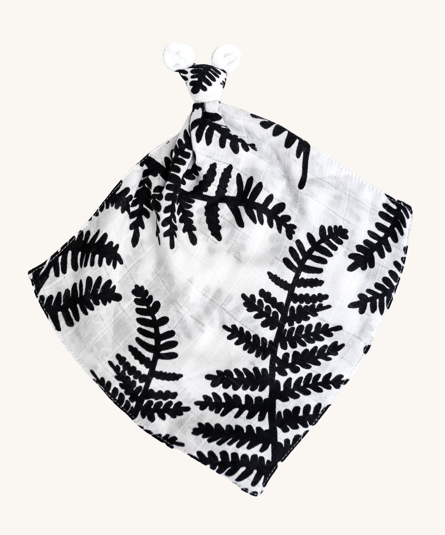 Etta Loves Organic Cotton Baby Comforter - Fern. A bold black and white fern leaf print, with a knotted top and soft ears