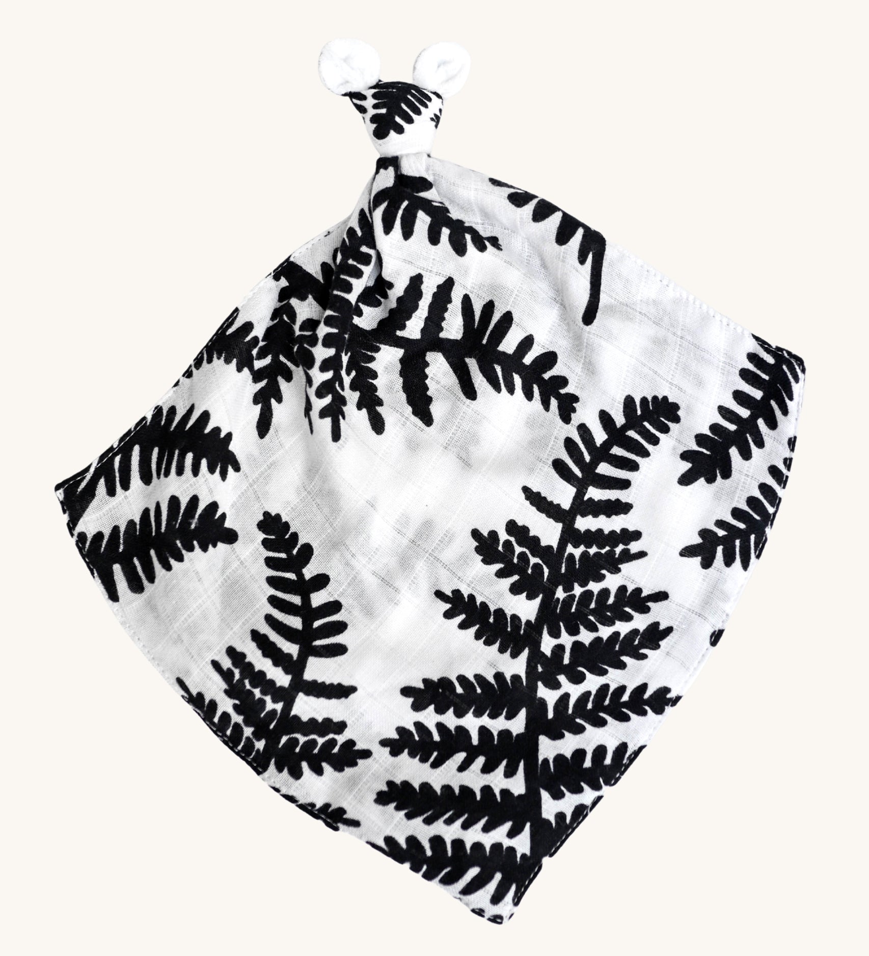 Etta Loves Organic Cotton Baby Comforter - Fern. A bold black and white fern leaf print, with a knotted top and soft ears